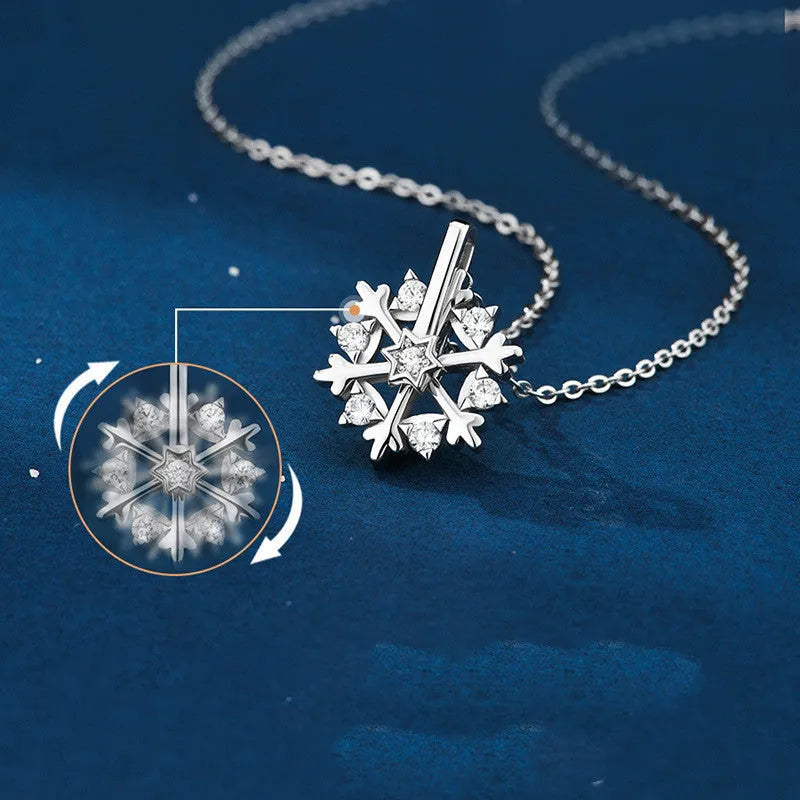 Rotatable S925 silver snowflake necklace for women with rhinestone detail, available in rose gold or white gold.