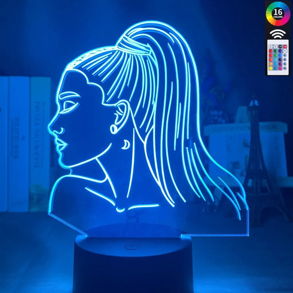 Slim acrylic 3D night light with LED illumination on a table.