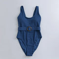 Women's navy blue one-piece swimsuit with triangle neckline and built-in chest padding