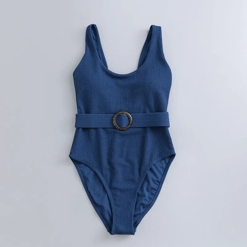 Women's navy blue one-piece swimsuit with triangle neckline and built-in chest padding