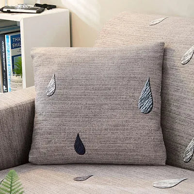 Geometric pattern stretchable sofa slipcover on three-seater sofa showing tight fit without wrinkles