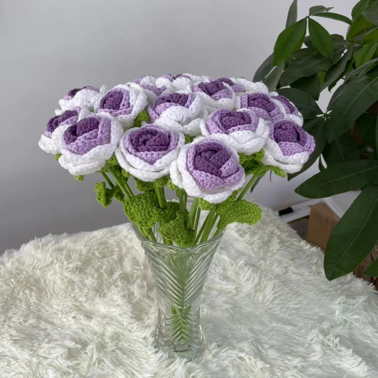 Artificial silk rose bouquet with blue gradient wool-weave petals on a single stem.