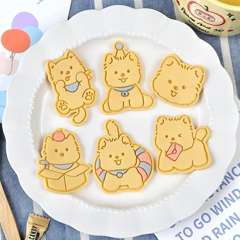 Three-dimensional press mould for creating puppy-shaped biscuits with seven design options including birthday hats