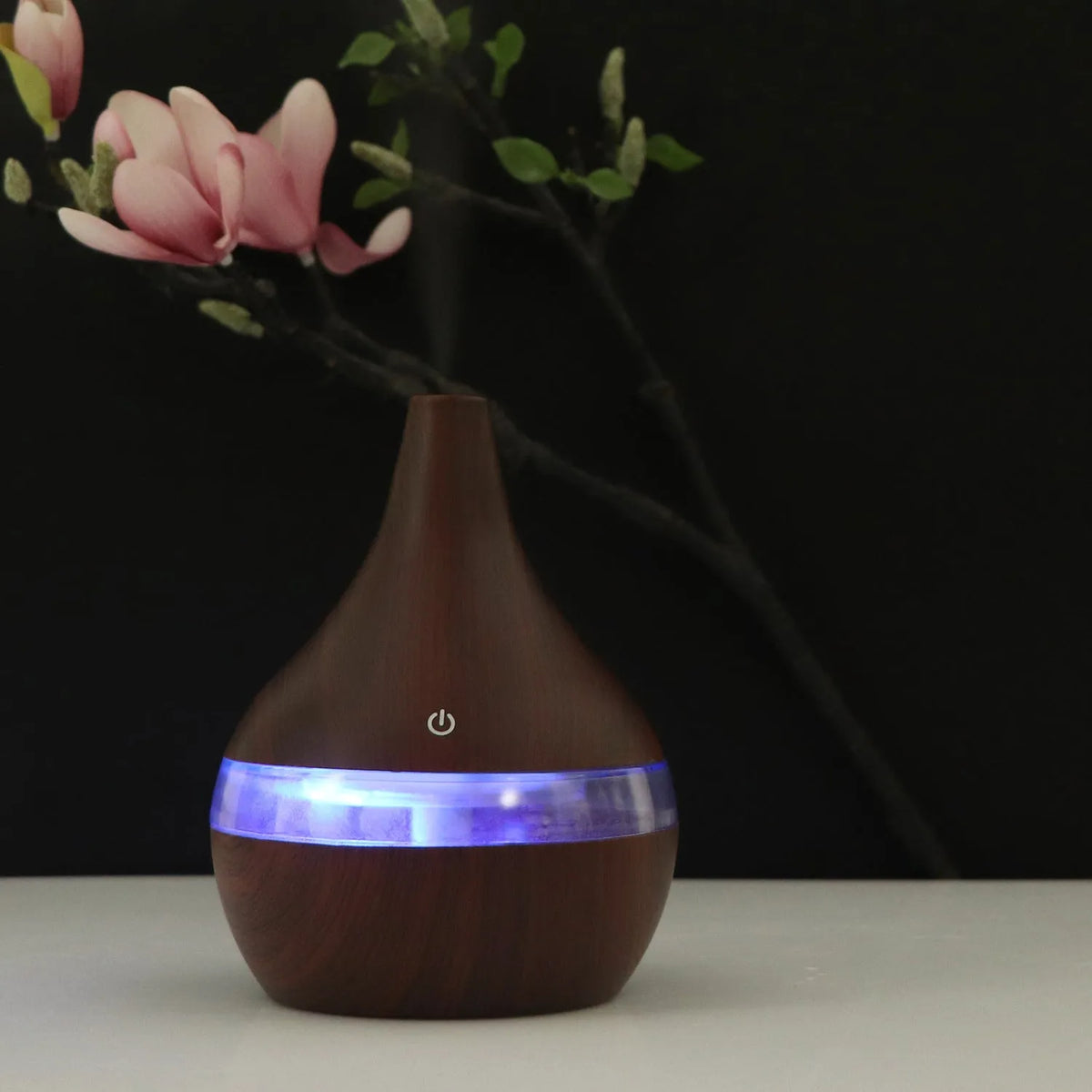 Columnar USB mini air humidifier in light wood grain finish with remote control