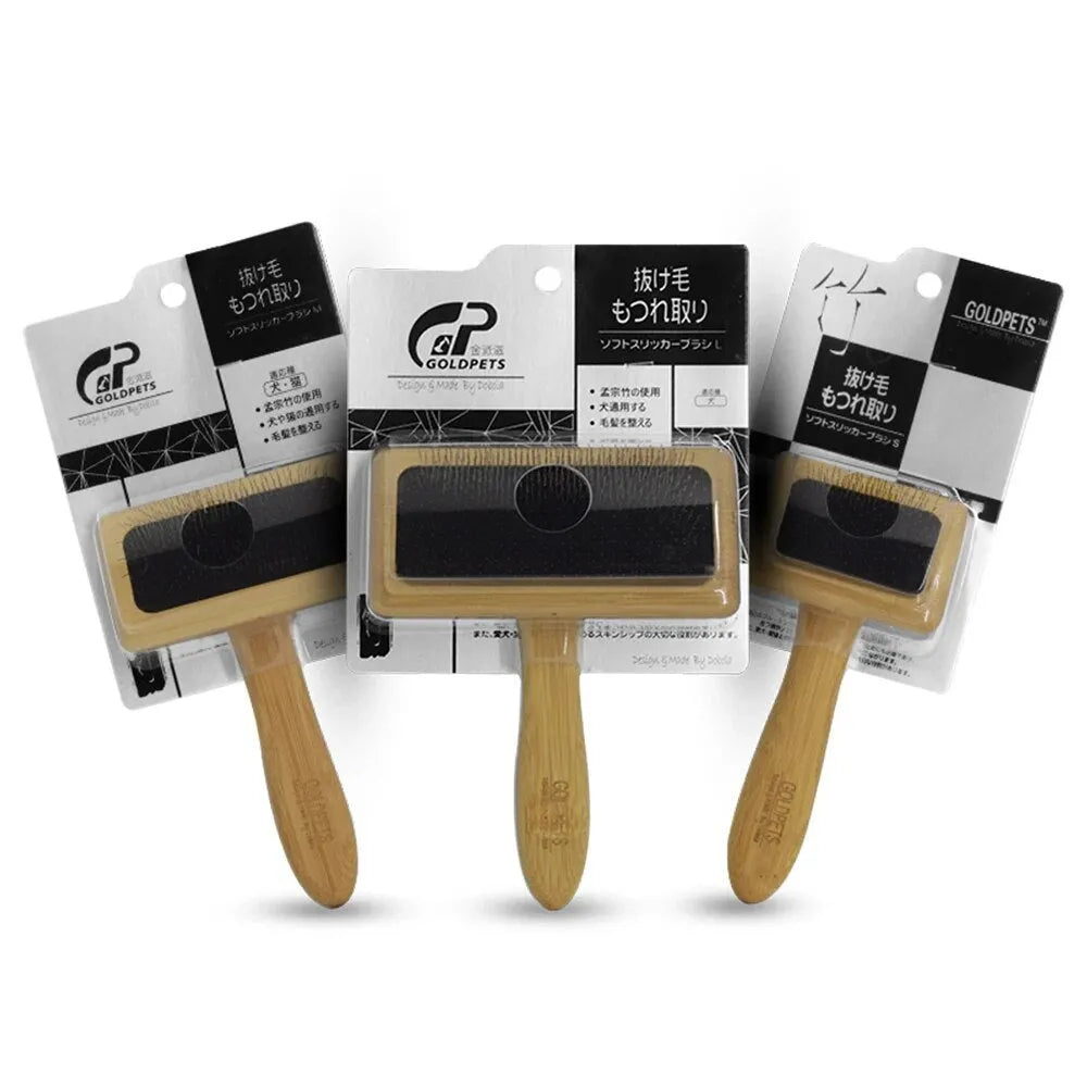 Goldpets bamboo wood pet slicker brush with stainless steel pins on a wooden table
