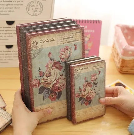 Hardcover notebook with cloth cover showing retro floral pattern in either lily, peony or white rose design