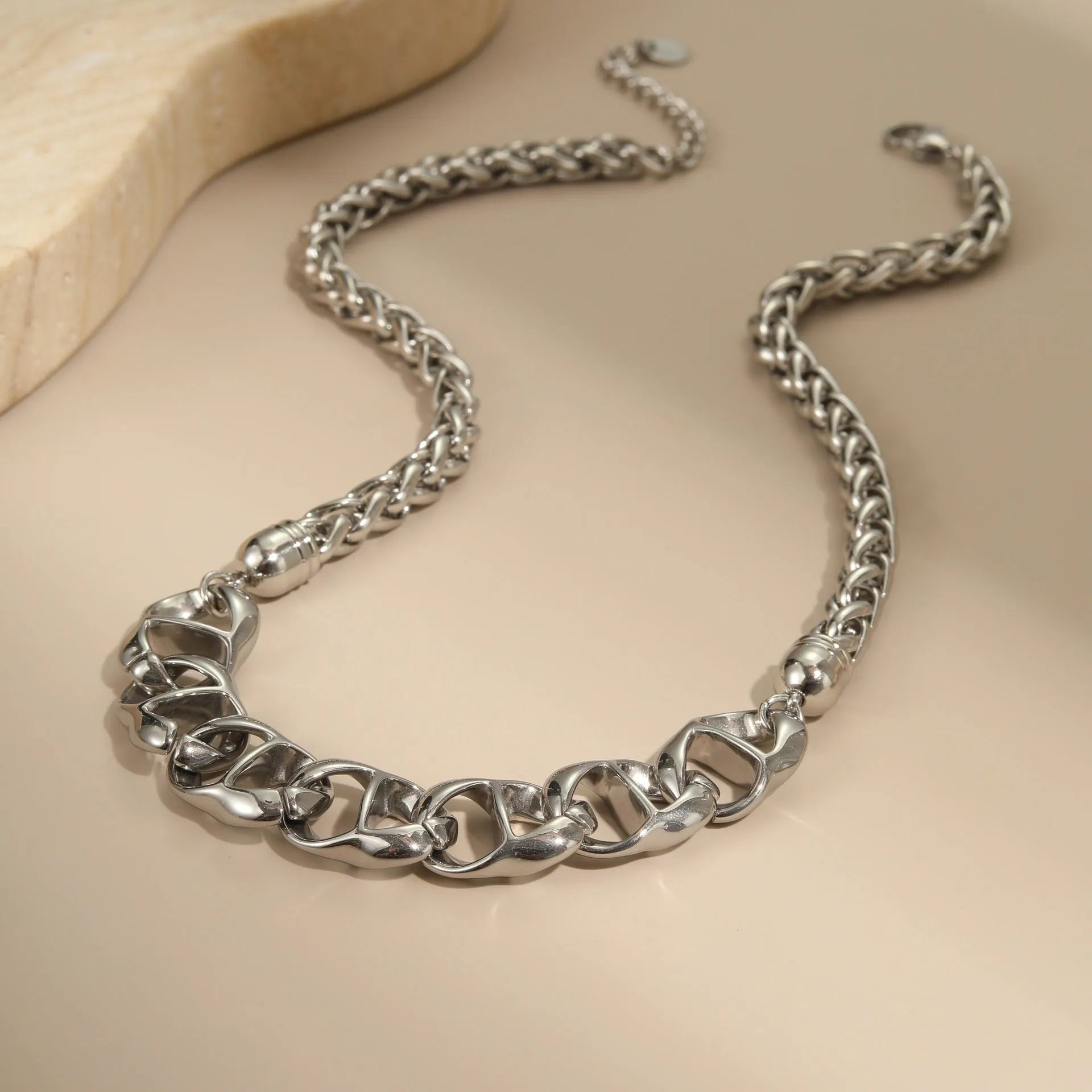 Stainless steel geometric necklace for women, shown in gold-plated and steel finish options.