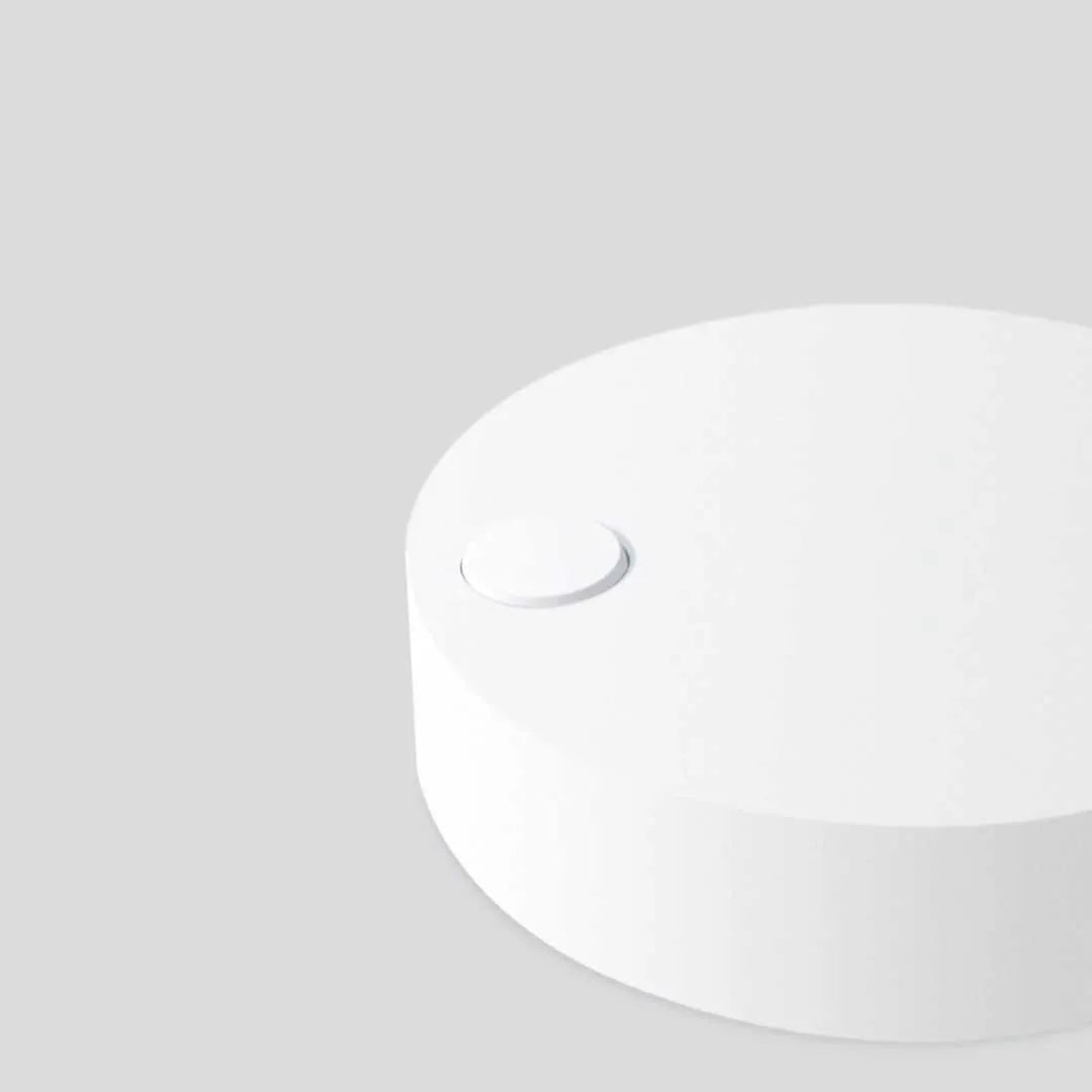 White clip-on LED selfie light for mobile phones showing three-level dimming buttons and USB port.