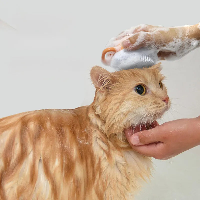 Orange TPR dog bath brush with shampoo dispenser and comb teeth for pet grooming