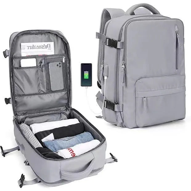 Waterproof mummy-style backpack in forest green colour showing roll-top closure and adjustable padded shoulder straps