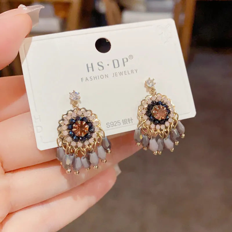Purple and blue round crystal tassel earrings with diamond accents and thick gold plating