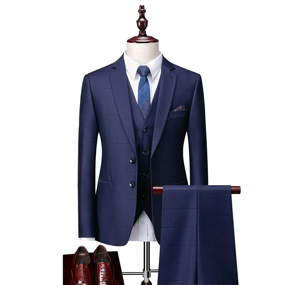 Men's navy blue three-piece slim fit suit with jacket, vest, and trousers on hanger
