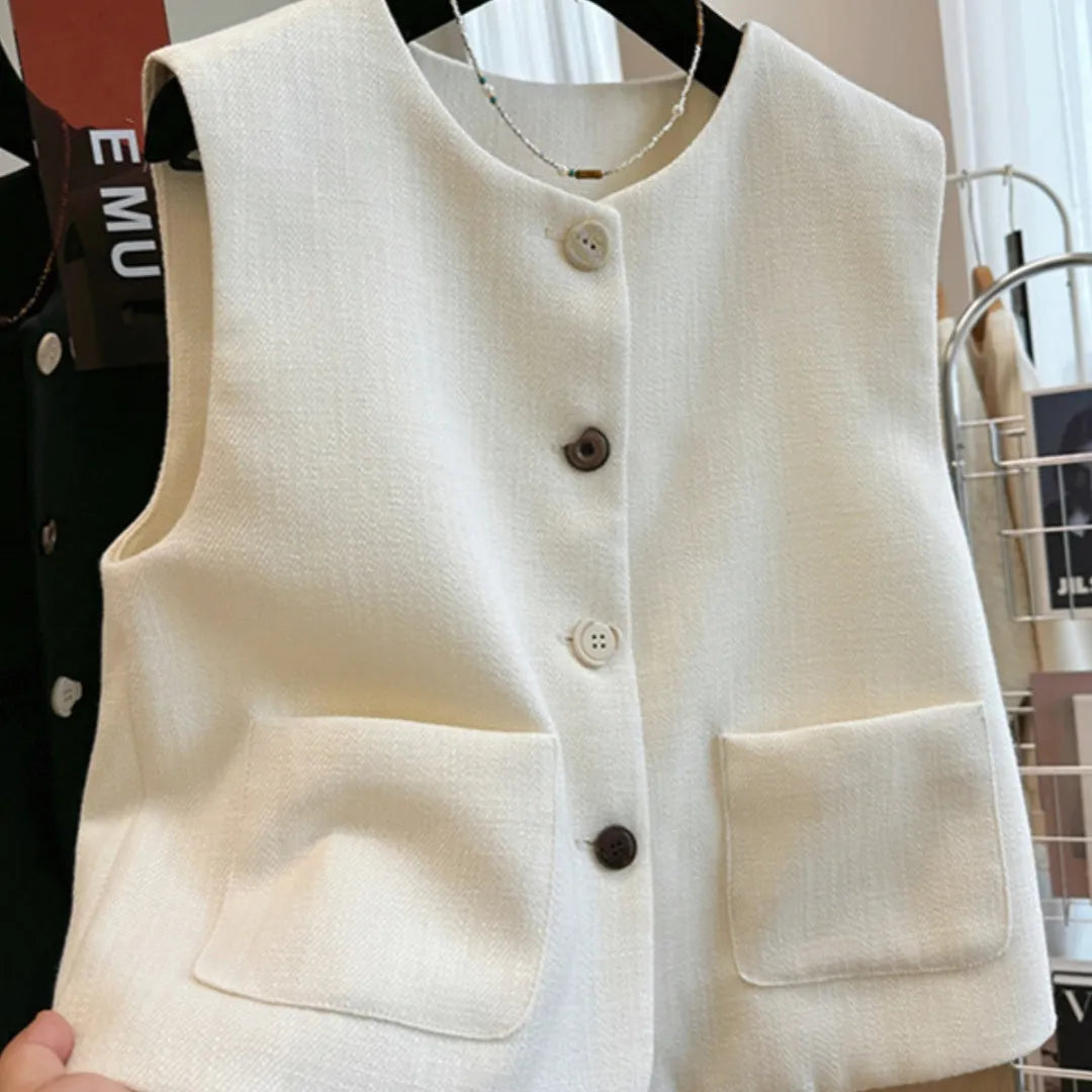 French style round neck sleeveless vest in milky white colour, showing bandage-style construction and polyester fabric texture