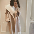 Plus size woman wearing a grey thin cotton coat with lace trim detail and long sleeves.