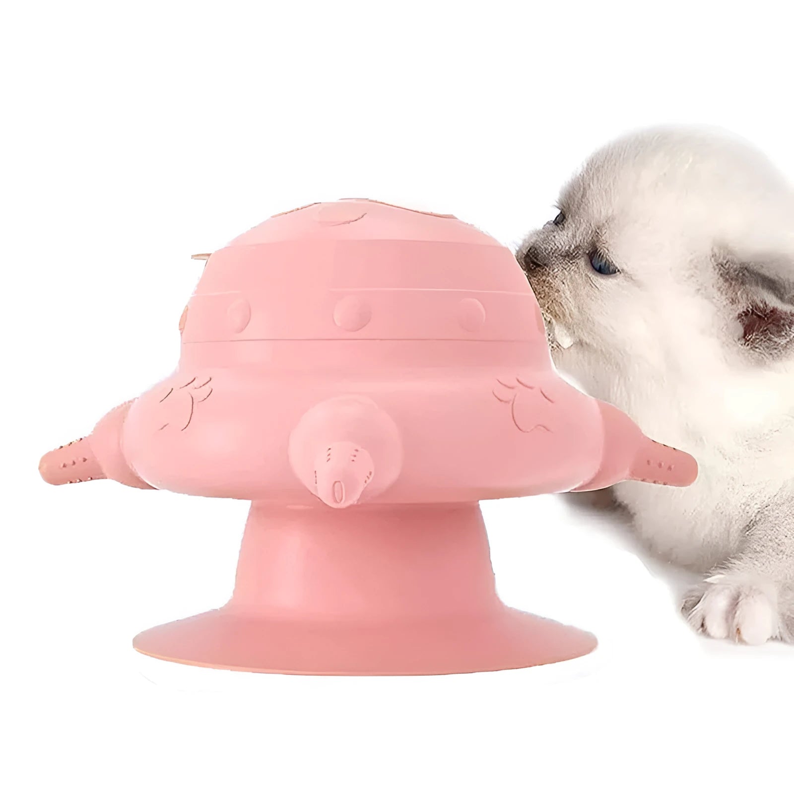 Pink silicone pet milk feeder with pacifier on a flat base, for puppies and kittens.