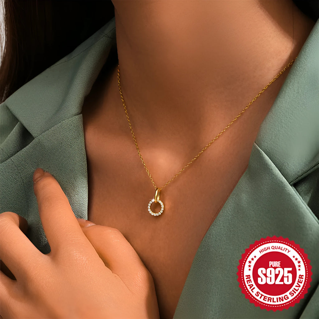 Gold colour geometric interlocking zircon pendant on an adjustable S925 sterling silver clavicle chain.