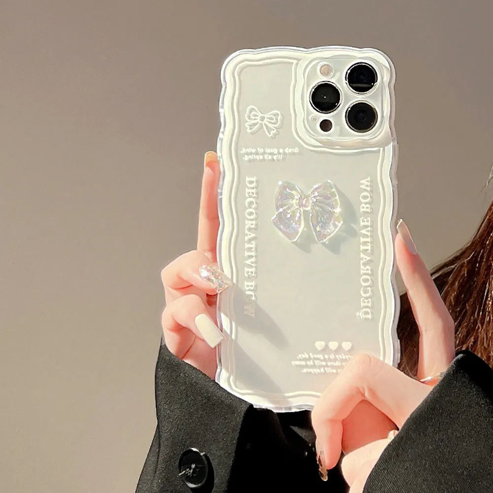 Transparent iPhone case with raised ice-through bow design on clear TPU background showing phone compatibility