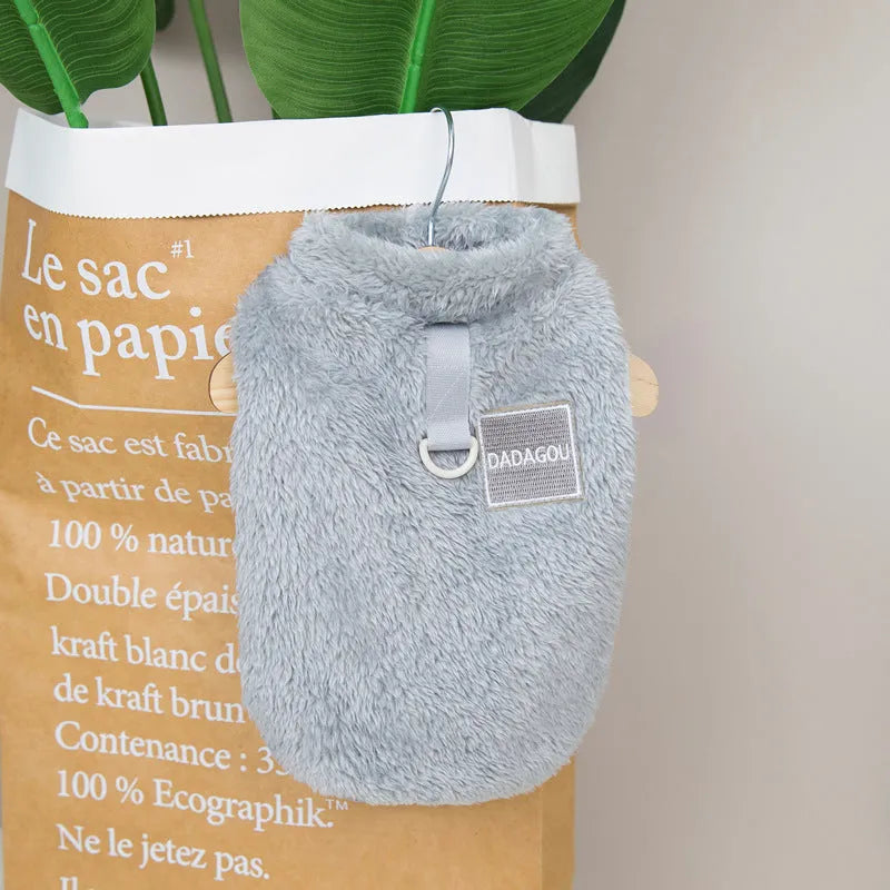 Blue coral fleece pet jacket for a dog, showing the coloured pull ring fastening.