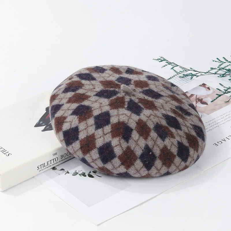Wool plaid beret with adjustable fit, dome crown, tassel and mesh detail, in blue light coffee plaid.