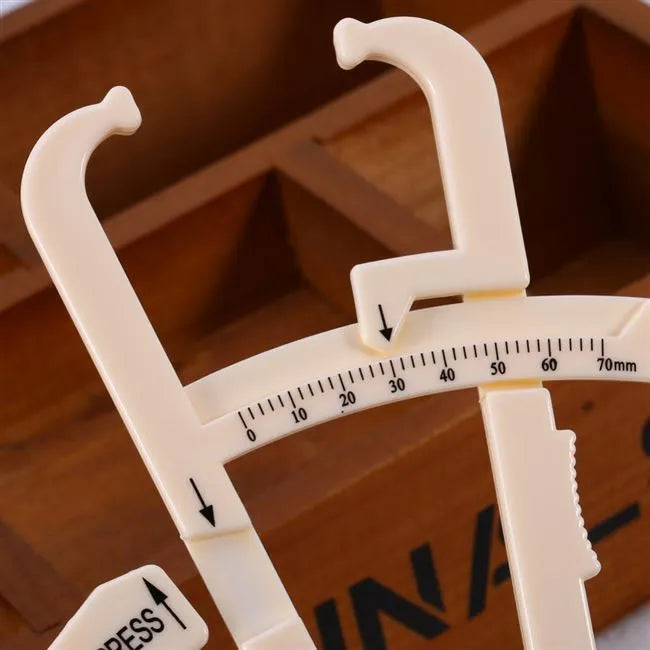 White acrylic fat caliper skin fold thickness meter showing 200mm range and 0.001mm accuracy for body fat measurement