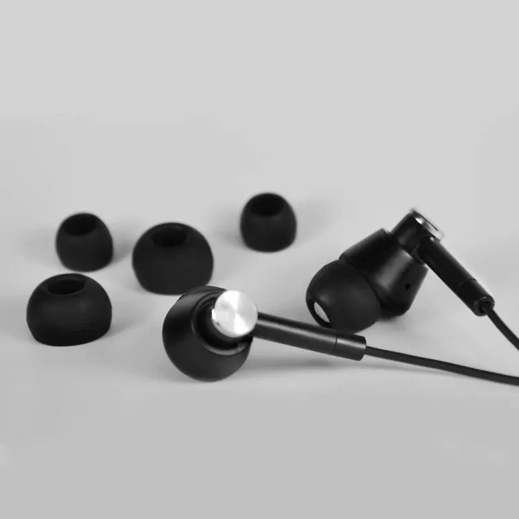 Black and white wired in-ear earphones with 3.5mm connector for mobile phones and computers