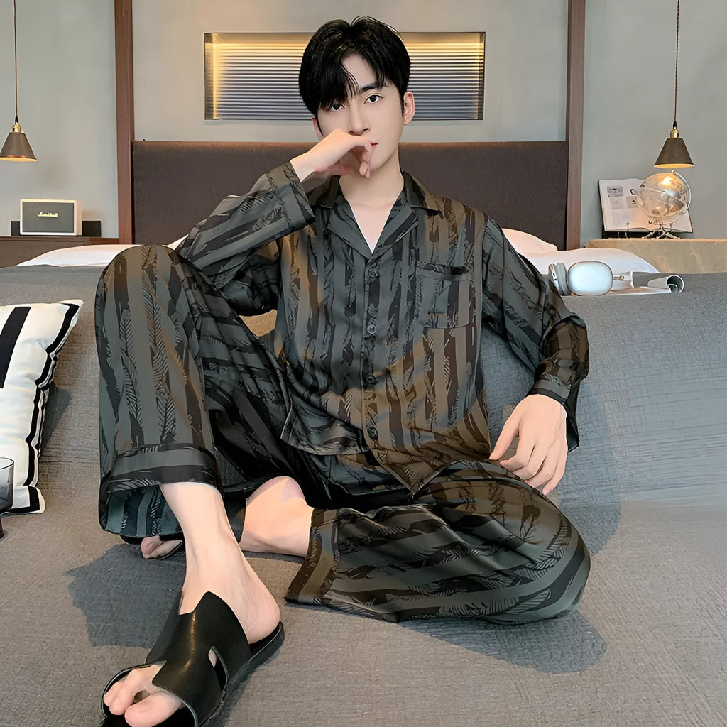 Men's black striped ice silk pajama two-piece set with V-neck top and long trousers.