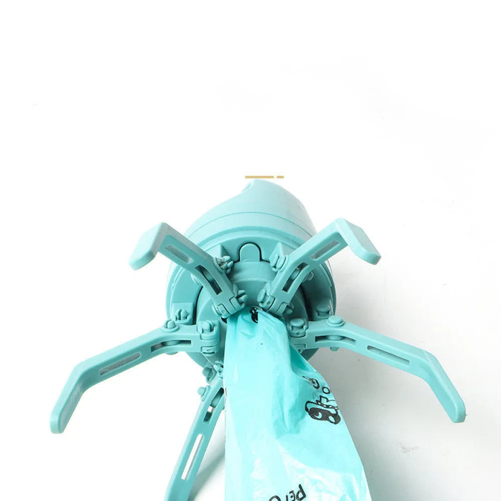 Blue plastic dog pooper scooper with claw mechanism and built-in bag dispenser