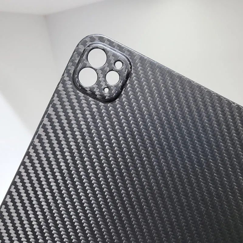 Carbon fibre flat protective cover for iPad Pro 11 showing embossed plaid pattern and precise port cutouts