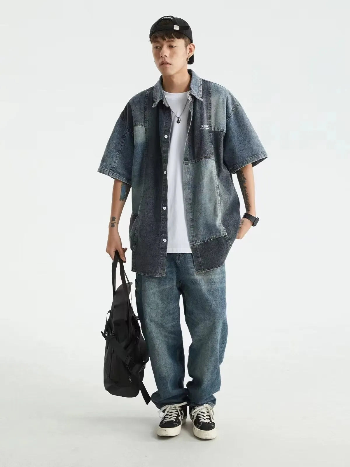 Men's blue loose-fit denim shirt with retro washed finish and cardigan style.