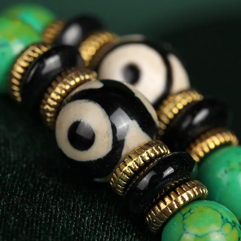 Natural turquoise gemstone bracelet with 108 round polished beads on a string.