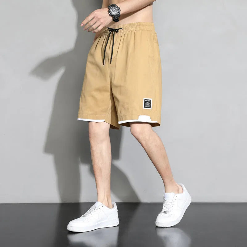 Cotton shorts for boys in black, khaki, or white with mid-waist design and shorts length