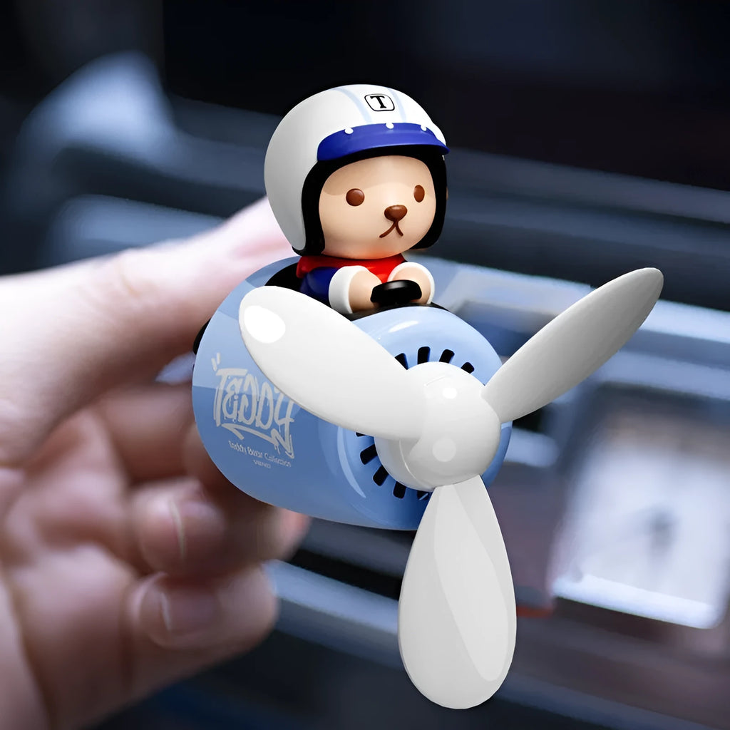 Blue plastic teddy bear-shaped car vent clip-on ornament with air freshener function
