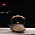Cast iron teapot with Japanese design, 0.9L capacity, for brewing tea.