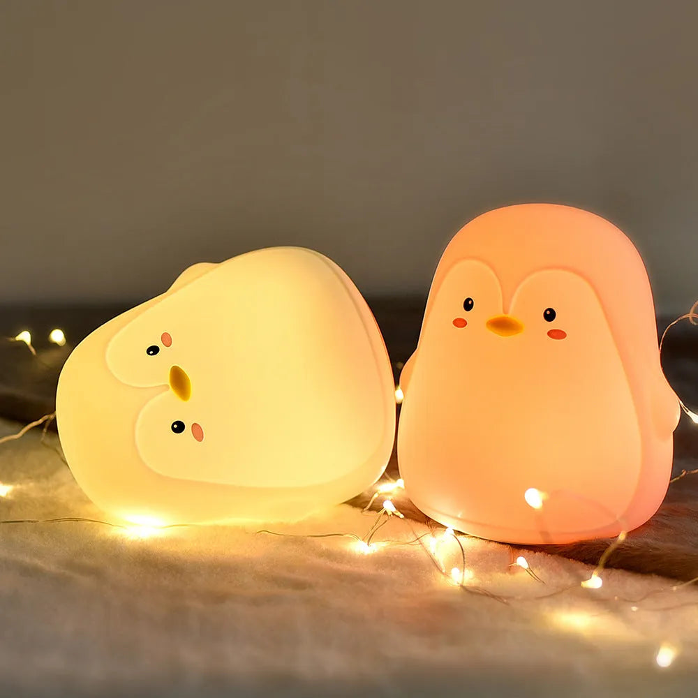 Penguin night light with rechargeable battery, silicone ABS construction, white LED light