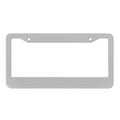 Minimalist black aluminium alloy car licence plate frame with slotted holes on a white background.