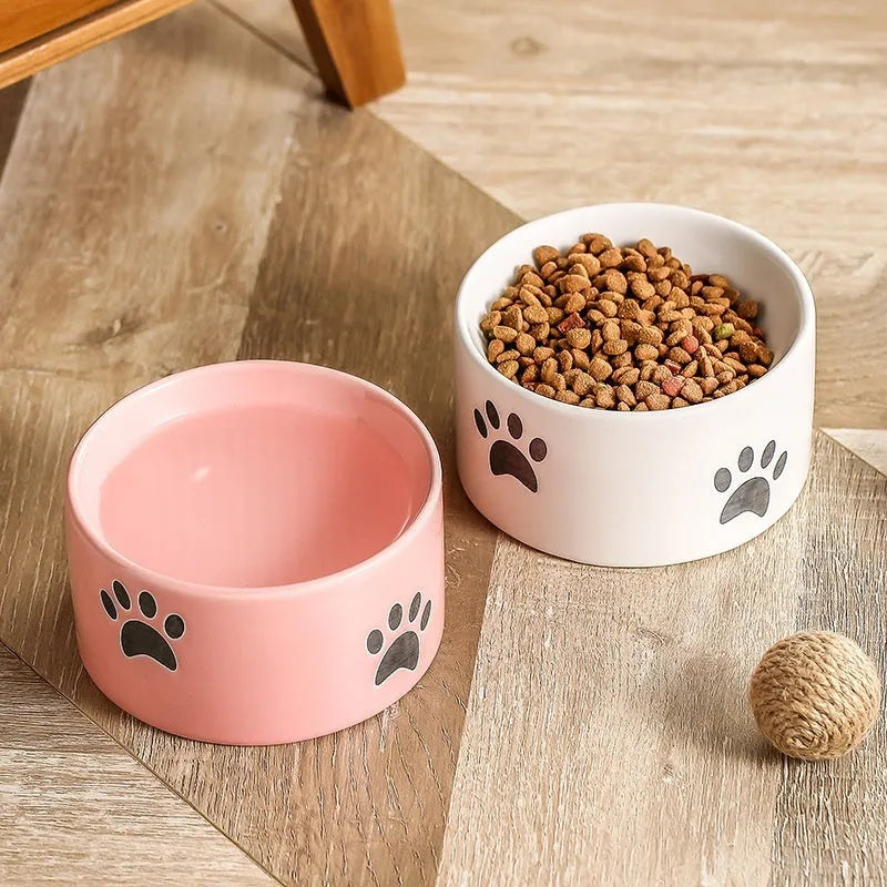 Ceramic cat bowl with high foot design and cat's paw pattern in choice of colours
