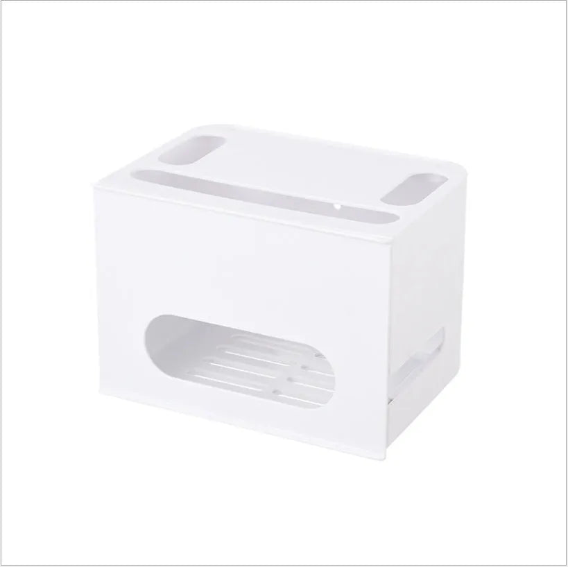 White plastic wireless router storage box mounted on a wall with cables routed through internal channels.