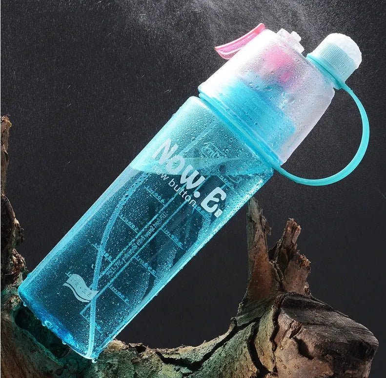Portable outdoor mist spray water cup with transparent body, handle, and spray nozzle in green colour