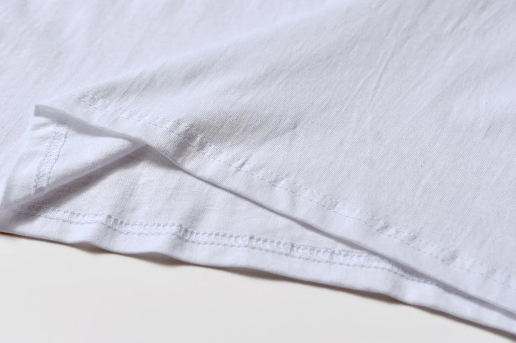White cotton t-shirt overalls with round neck and short sleeves in patterned design
