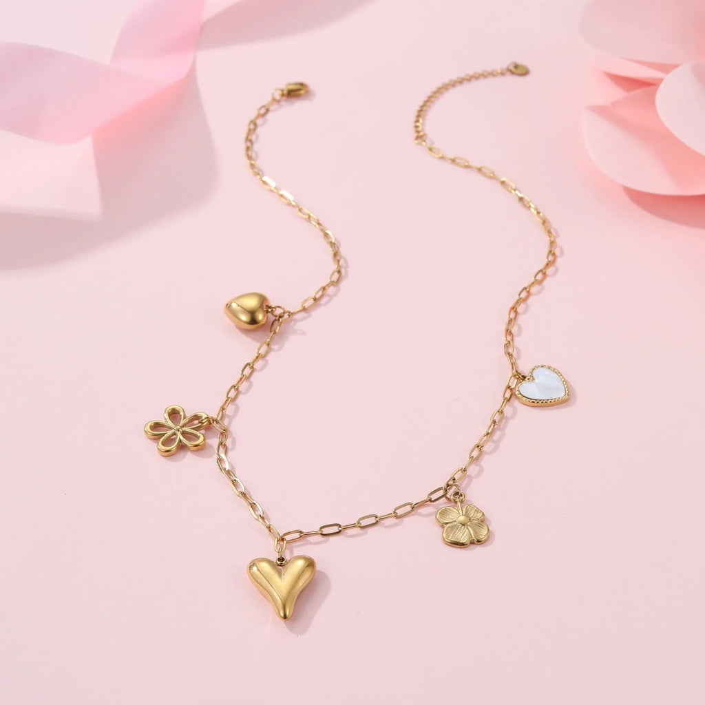 Stainless steel necklace with a geometric sun pendant on a regular chain, showing heart and ribbon sun style options.