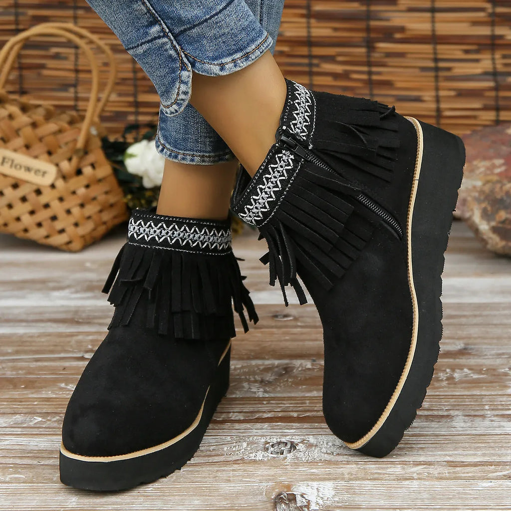 Women's suede wedge bootie in dark brown with side zipper and tassel detail on a 4cm rubber sole