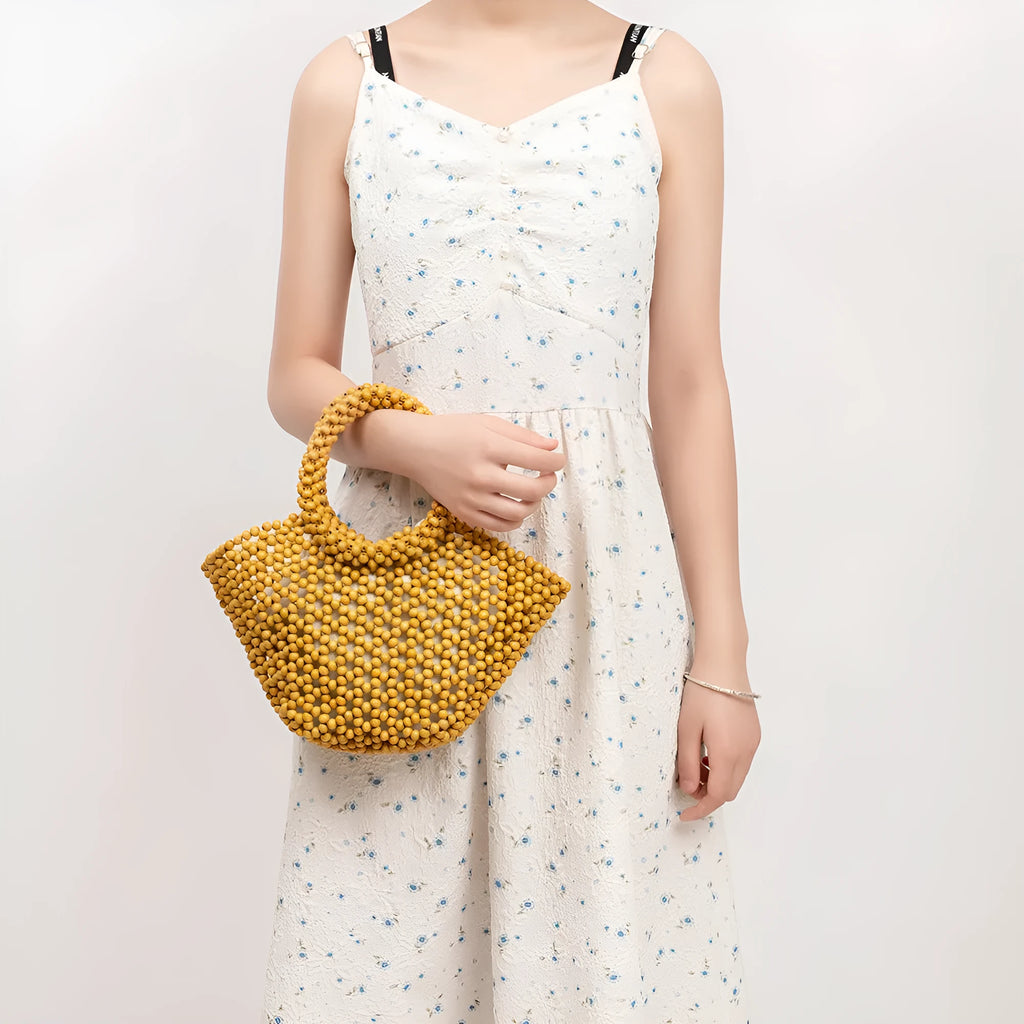 Hand-woven maple wood beach bag with wooden beads in dumpling shape.