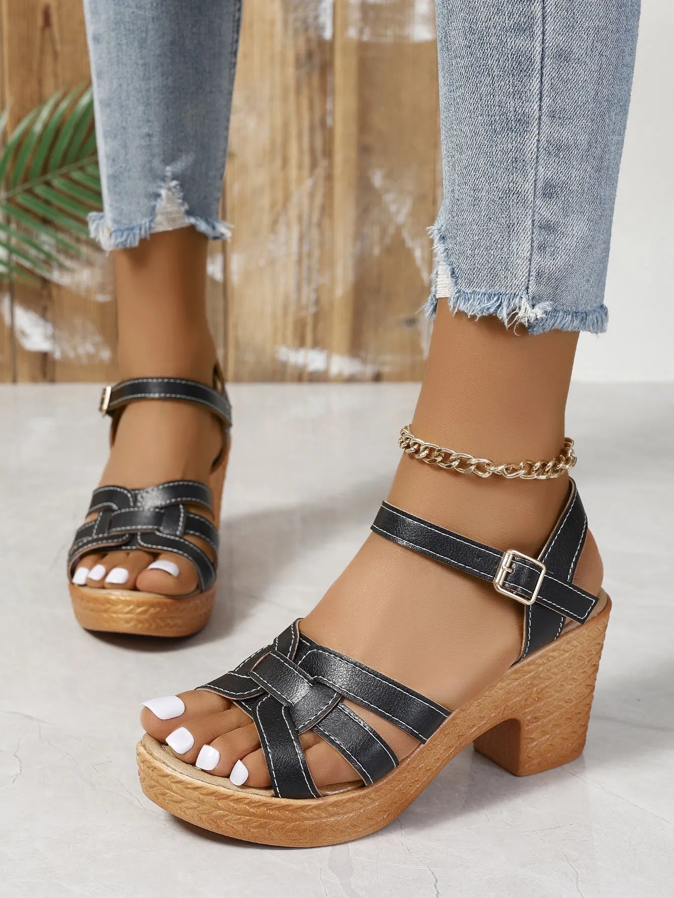 Plus size black Roman-style women's peep toe sandals with chunky heel and ankle-strap buckle.