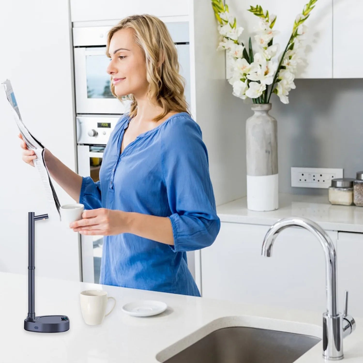 White and blue desktop water dispenser with extension tube on counter next to water bottle