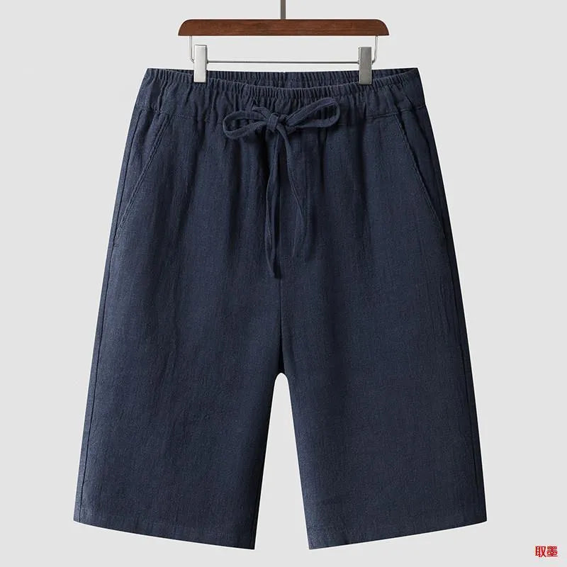 Men's loose linen shorts in beige colour with cropped length and elastic waistband