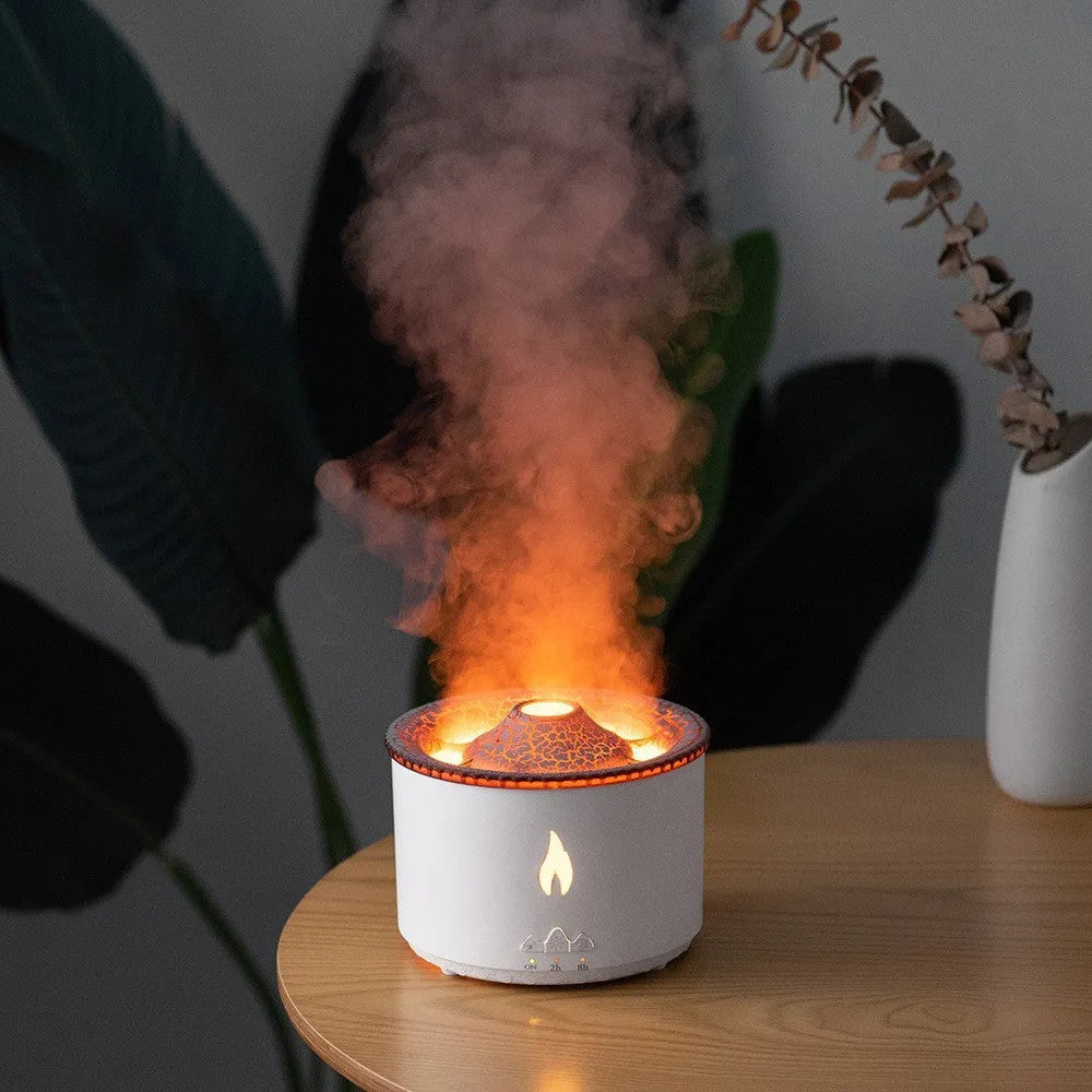 Round white volcano-shaped humidifier with water tank and single fog outlet on wooden surface