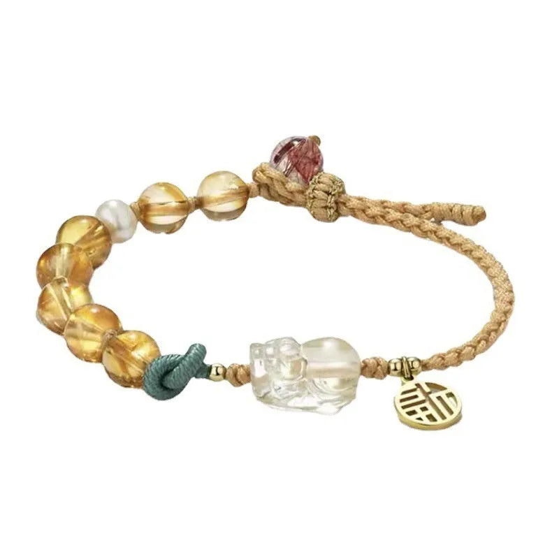 Hand-woven crystal bracelet with animal zodiac design in citrine colour