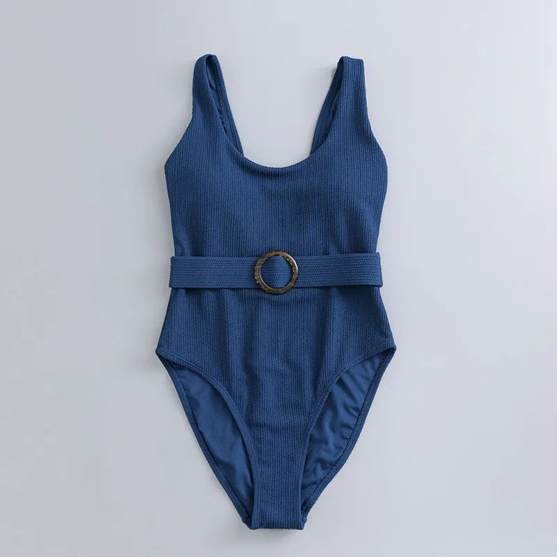 Women's navy blue one-piece swimsuit with triangle neckline and built-in chest padding