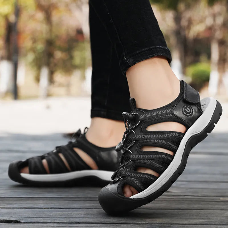 Women's black leather mesh sandals with elastic band and rubber sole, shown in size 38.