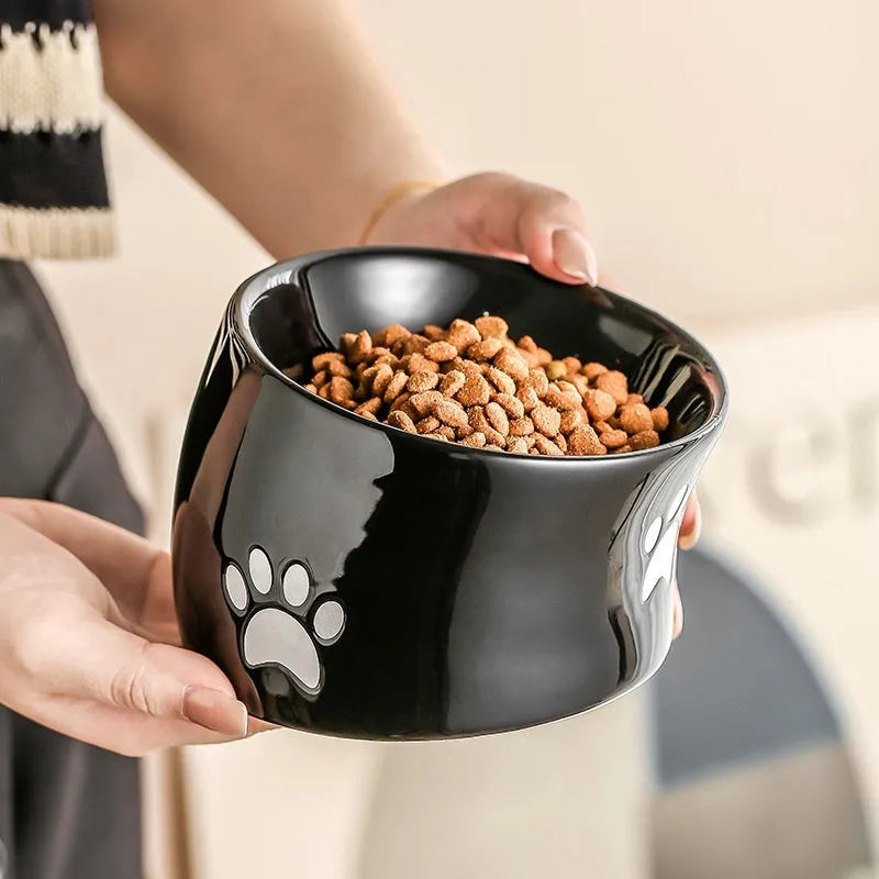 Ceramic cat bowl with high foot design and cat's paw pattern in choice of colours